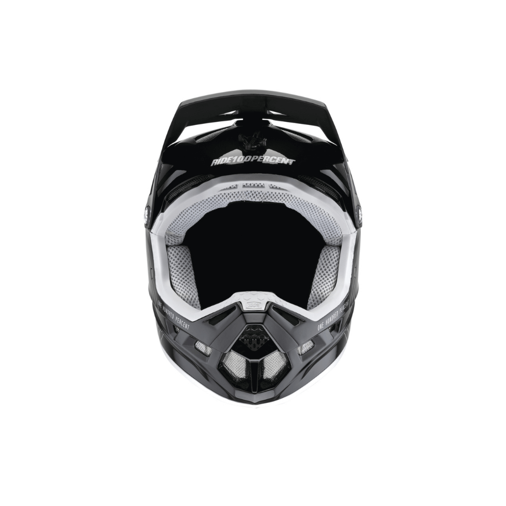 front view of a black full face helmet with white internal padding and mesh panel vents